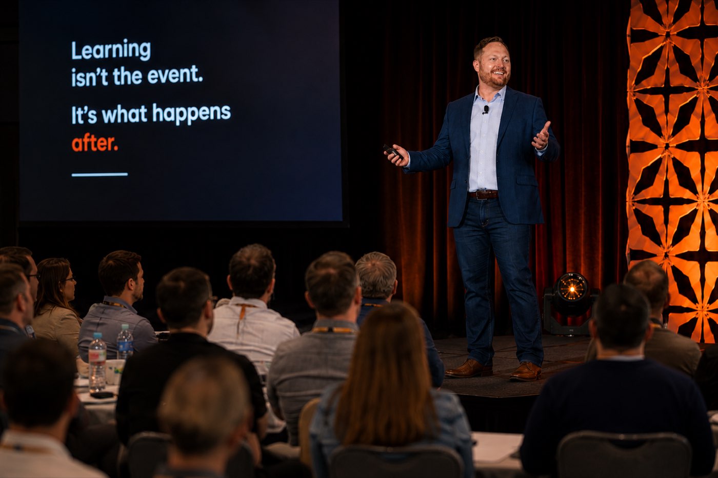 Mike A Martin delivering a keynote to a full audience